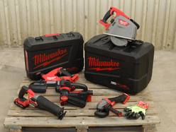  a set of power tools from Milwaukee placed on a table next to protective cases