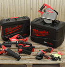  a set of power tools from Milwaukee placed on a table next to protective cases
