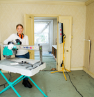 a women using a tile cutter 