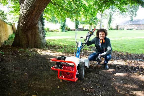 a man using a rotavator