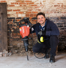 a worker holding a large breaker