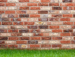 a brick wall with mixed red and orange colour