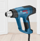 Bosch heat gun to remove paint with a modern house background