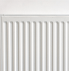 White household radiator mounted on a plain wall.