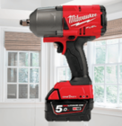 Red Milwaukee cordless impact wrench displayed in a bright room with white-framed windows and woven blinds.