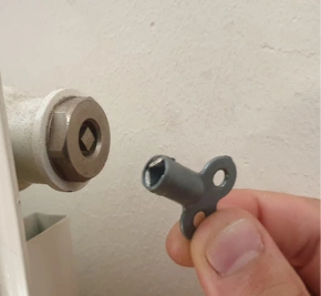 The radiator bleed valve and the key to open it