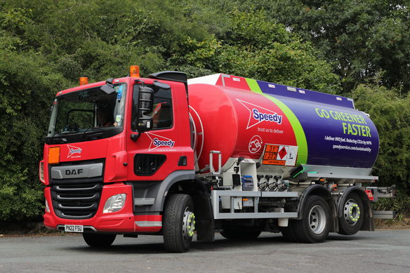 a Speedy fuel tanker with the slogan 'Go Green Faster' written on
