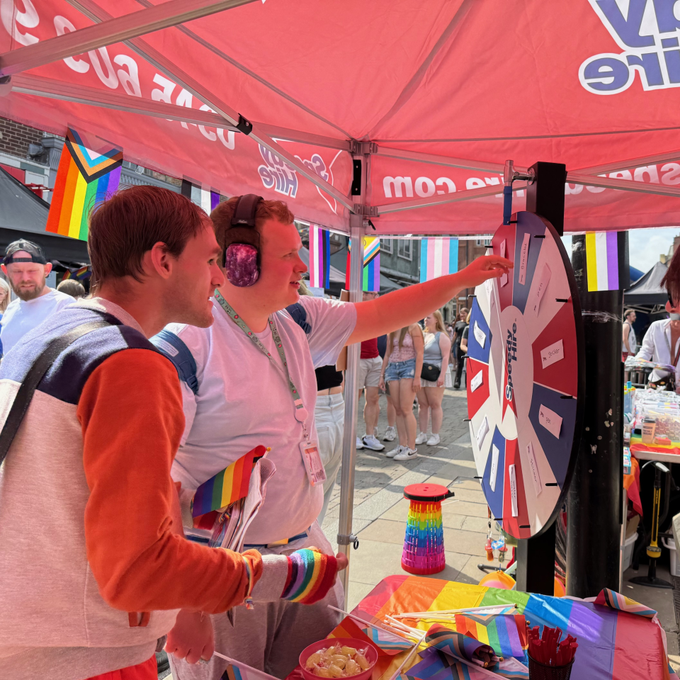 people playing games at Speedy booth