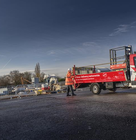 a red speedy truck on a construction site