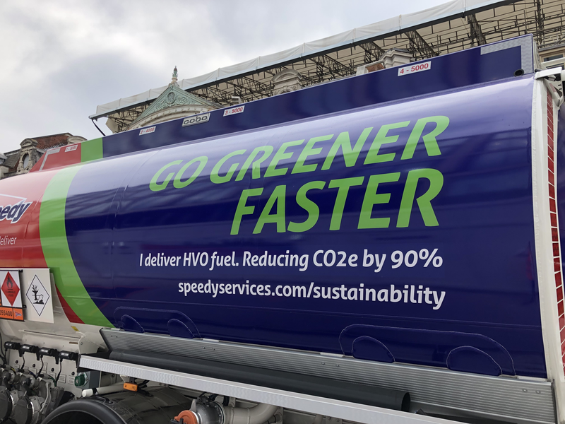 a close-up of a fuel tank with the line Go green faster